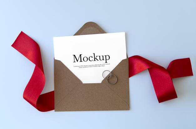 Free Envelope With Red Ribbon And Rings Mockup Psd