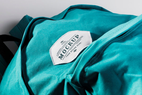 Free Fabric Clothing Patch Mock-Up On Blue Backpack Psd