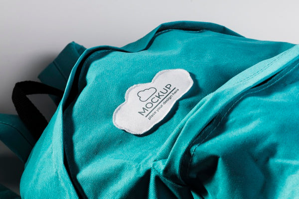 Free Fabric Clothing Patch Mock-Up On Blue Backpack Psd