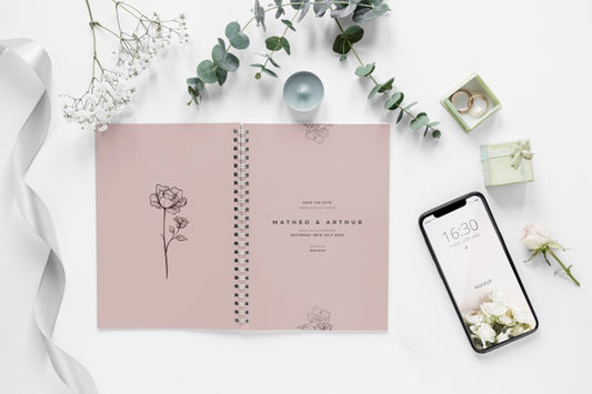 Free Fat Lay Of Wedding Notebook With Smartphone And Plants Psd