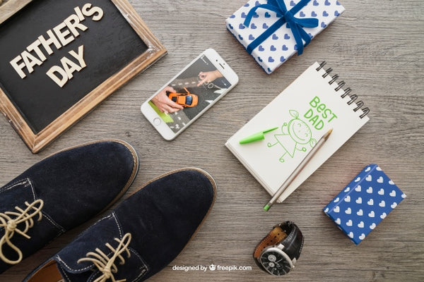 Free Father'S Day Composition With Notepad And Shoes Psd