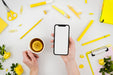 Free Flat Lay Hands Holding Smartphone Mock-Up With Stationery Psd