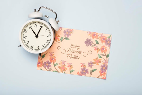 Free Flat Lay Of Clock And Floral Card For Spring Psd