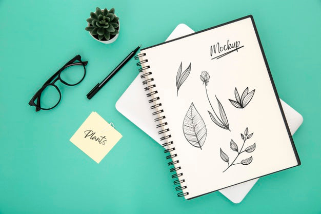 Free Flat Lay Of Desk Surface With Notebook And Pen Psd