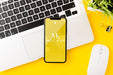 Free Flat Lay Phone Mock-Up On Laptop Psd