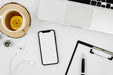Free Flat Lay Smartphone Mock-Up With Earphones On Desk Psd
