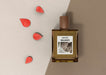 Free Flower Petals Next To Perfume Bottle Psd