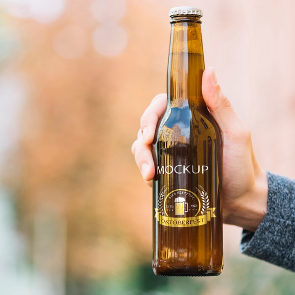 Free Front View Beer Bottle Held By Person Psd