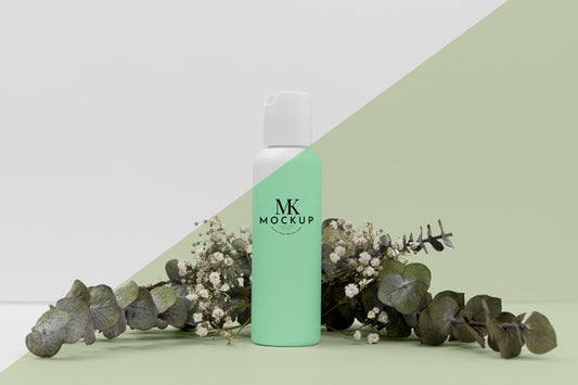 Free Front View Of Beauty Product Bottle With Plant Psd