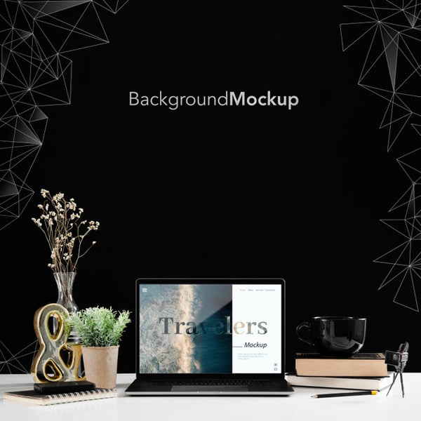 Free Front View Of Desk With Laptop And Plant Psd