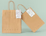Free Front View Of Paper Shopping Bag Mock-Up With Paper Tag Psd