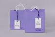 Free Front View Of Paper Shopping Bag Mock-Up With Paper Tag Psd