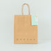 Free Front View Of Paper Shopping Bag Mock-Up With Paper Tag Psd