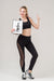 Free Front View Of Smiley Fitness Woman Holding Notepad And Giving Thumbs Up Psd