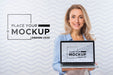 Free Front View Of Smiley Woman Holding Laptop Psd