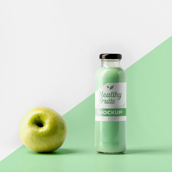 Free Front View Of Transparent Juice Bottle With Cap And Apple Psd