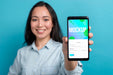 Free Front View Smiley Girl Holding Smartphone Psd