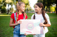 Free Girls Holding Together Paper With Motivational Message Psd