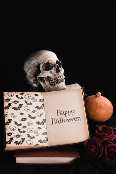 Free Halloween Concept With Skull And Book On Black Background Psd