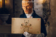 Free Halloween Mockup With Monster Holding Cardboard Psd