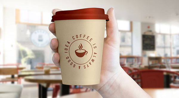 Free Hand Holding Coffee Cup Mockup Psd