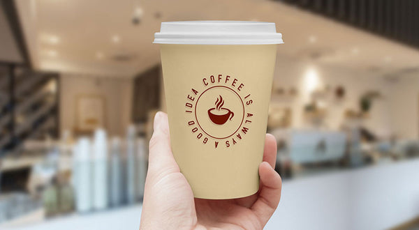 Free Hand Holding Coffee Cup Mockup Psd