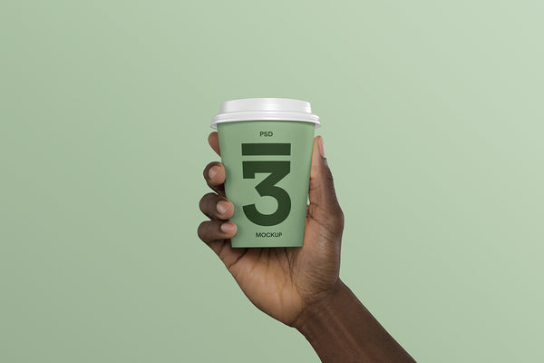 Free Hand Holding Coffee Cup Mockup