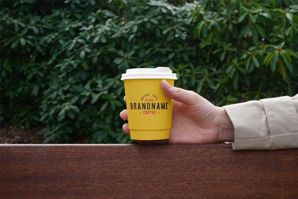 Free Hand Holding Coffee Cup Psd Mockup