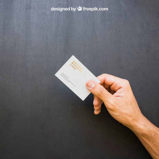 Free Hand Holding Golden Business Card Psd