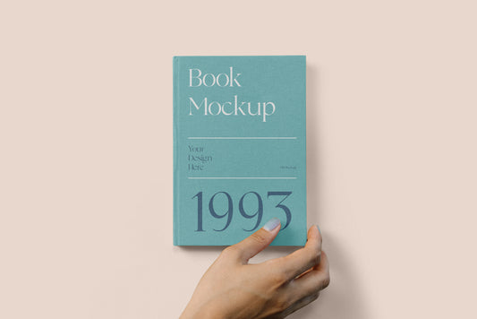 Free Hard Cover Book With Hand Mockup