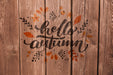 Free Hello Autumn Written On A Wooden Background Psd