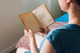 Free High Angle Of Woman Reading A Book Psd