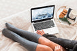 Free High Angle Woman Looking At A Laptop With Mock-Up Screen Psd