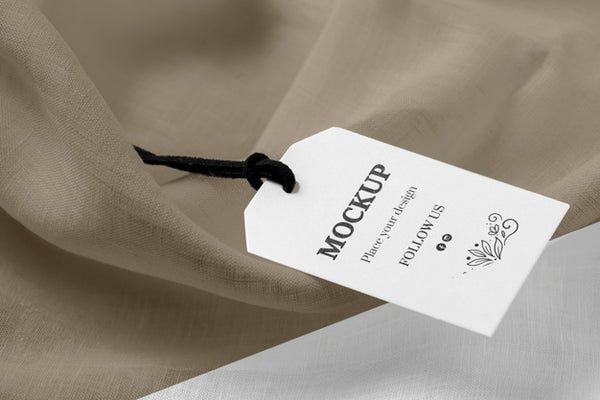 Free High View Mock-Up Of Clothing Labels On Soft Fabric Psd