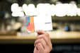 Free Holding Up A Business Card Mockup Psd