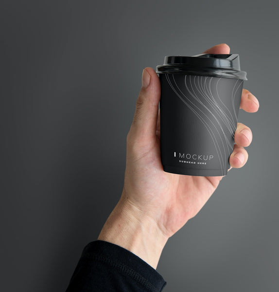 Free Human Hand Holding A Mockup Coffee Cup