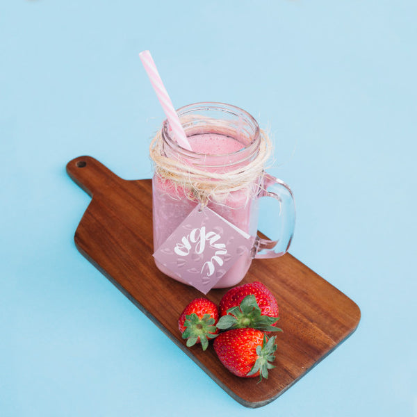 Free Jar Mockup With Pink Yogurt And Strawberries Psd