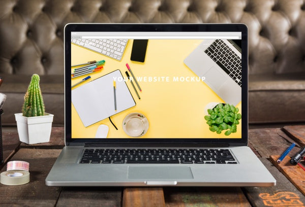 Free Laptop Mockup On Wooden Table Psd