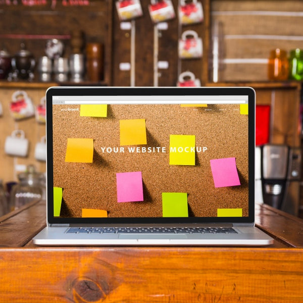 Free Laptop Mockup On Wooden Table Psd