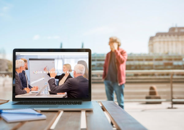 Free Laptop On Table In City Psd