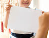 Free Little Boy With A Blank Paper Mockup Psd