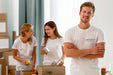 Free Male Volunteer Posing With Arms Crossed While Colleagues Prepare Donation Boxes Psd