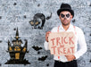 Free Male With Make-Up Holding A Card With Trick Or Treat Lettering For Halloween Psd