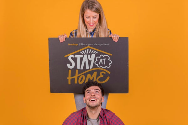 Free Man And Woman Holding A Sign Concept Mock-Up Psd