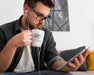 Free Man At Home Drinking From Mug Mock-Up Psd