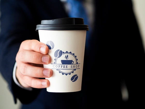 Free Man Holding A Coffee Cup Mock-Up Psd