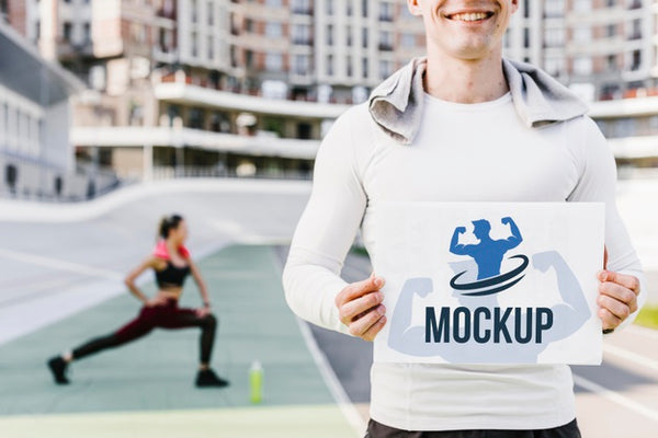 Free Man Holding Fitness Mock-Up Front View Psd