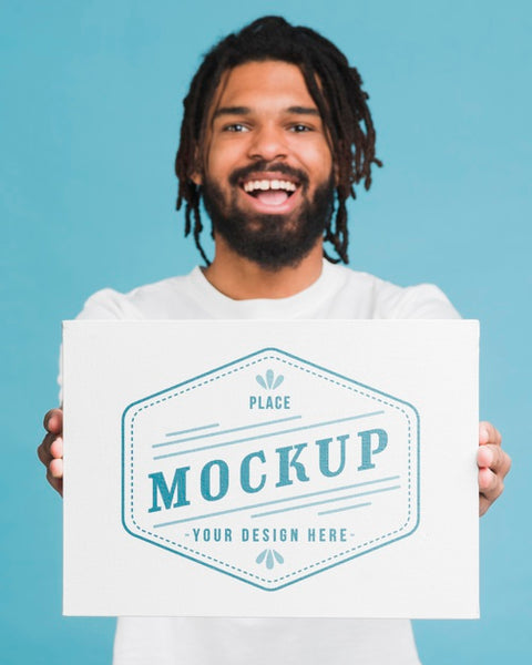 Free Man Holding Poster Mockup Psd