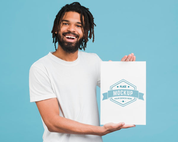 Free Man Holding Poster Mockup Psd