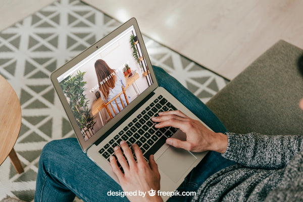 Free Man Using Laptop On Sofa Psd